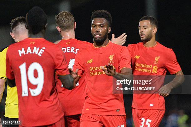 Liverpool's English striker Daniel Sturridge celebrates scoring Liverpool's fifth goal during the English League Cup second round football match...
