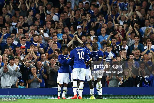 Arouna Kone of Everton celebrates scoring his team's third goal with team mates during the EFL Cup second round match between Everton and Yeovil Town...
