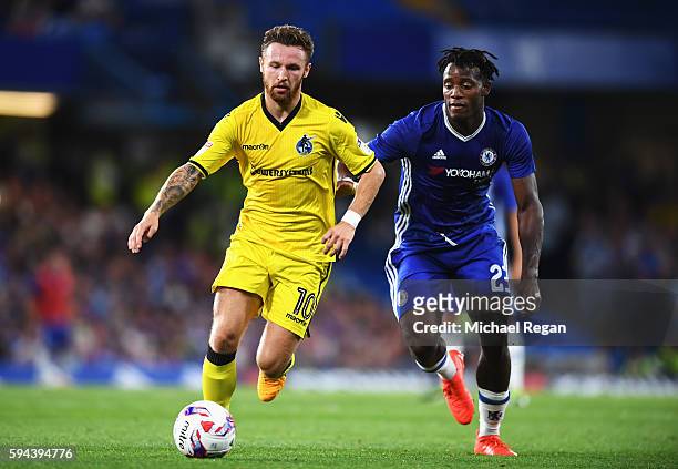 Matty Taylor of Bristol Rovers and Michy Batshuayi of Chelsea in action during the EFL Cup second round match between Chelsea and Bristol Rovers at...