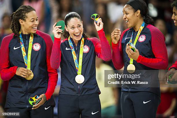 Summer Olympics: USA Seimone Augustus, Sue Bird and Maya Moore victorious with gold medals on the podium after defeating Spain in Women's Final -...