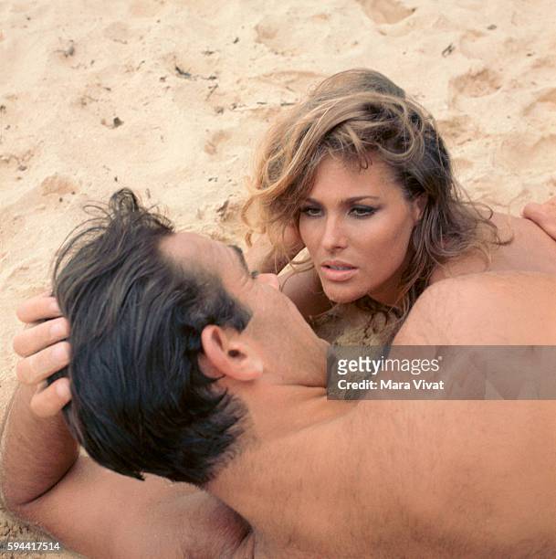 Ursula Andress and Sean Connery lay on the beach during the filming of Dr. No, the first film of the James Bond 007 series by Ian Fleming.