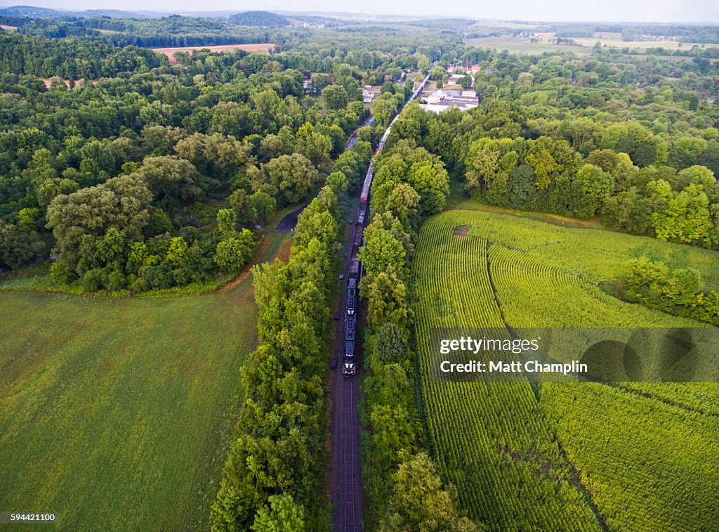 Aerial of Freight Train traveling along tracks