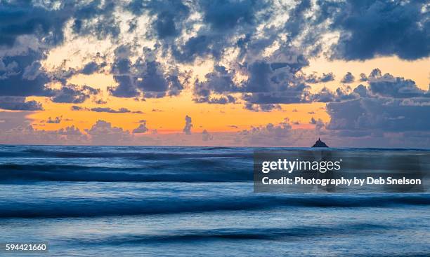 tillamook rock and sunset on cannon beach - tillamook rock light stock pictures, royalty-free photos & images