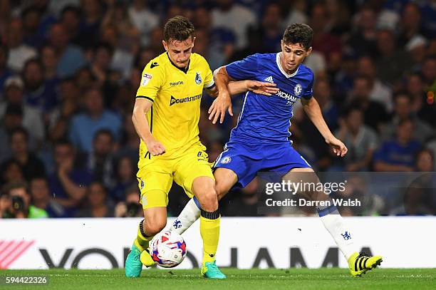 Tom Lockyer of Bristol Rovers and Oscar of Chelsea in action during the EFL Cup second round match between Chelsea and Bristol Rovers at Stamford...