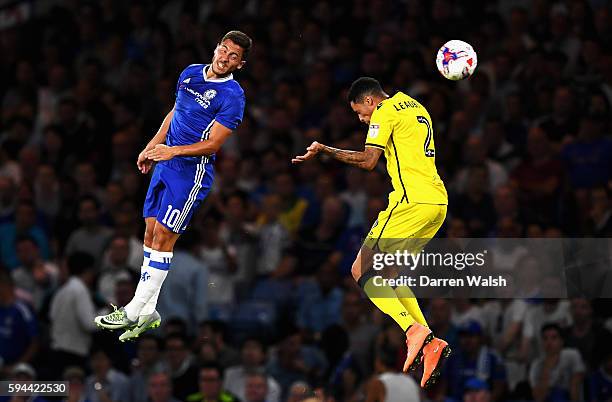 Eden Hazard of Chelsea wins a header with Daniel Leadbitter of Bristol Rovers during the EFL Cup second round match between Chelsea and Bristol...