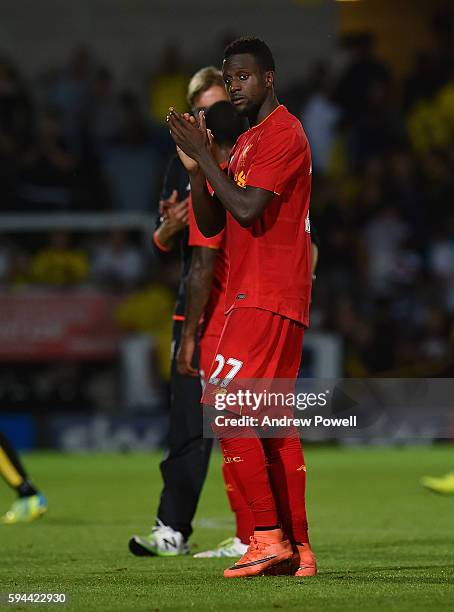 Divock Origi of Liverpool shows his appreciation to the fans at the end of the EFL Cup match between Burton Albion and Liverpool at the Pirelli...