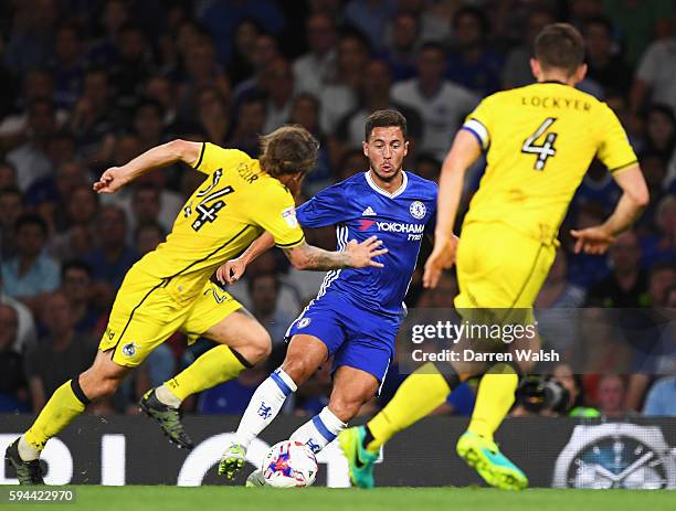 Eden Hazard of Chelsea takes on Stuart Sinclair and Tom Lockyer of Bristol Rovers during the EFL Cup second round match between Chelsea and Bristol...