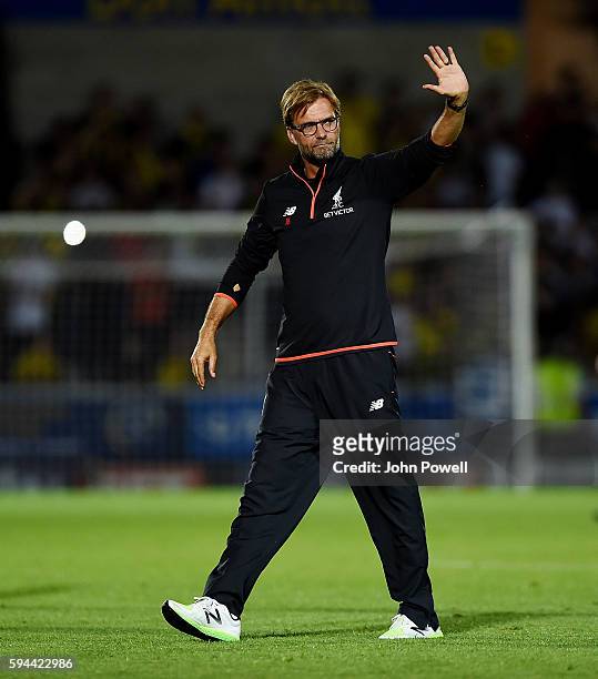 Jurgen Klopp manager of Liverpool shows his appreciation to the fans at the end of the EFL Cup match between Burton Albion and Liverpool at the...