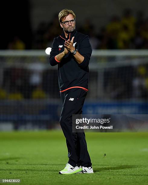 Jurgen Klopp manager of Liverpool shows his appreciation to the fans at the end of the EFL Cup match between Burton Albion and Liverpool at the...