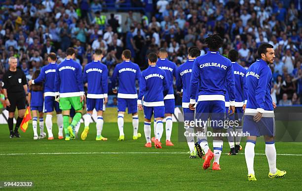 The Chelsea side walk out onto pitch as Pedro of Chelsea looks on during the EFL Cup second round match between Chelsea and Bristol Rovers at...