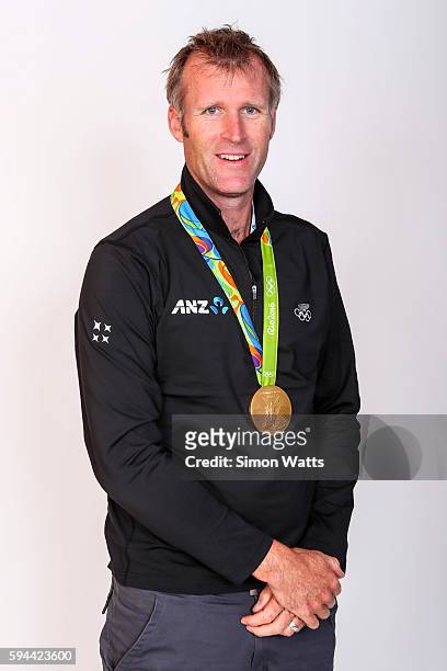 Mahe Drysdale poses for a portrait with his Olympic Gold medal during the New Zealand Olympic Games athlete home coming at Auckland International...
