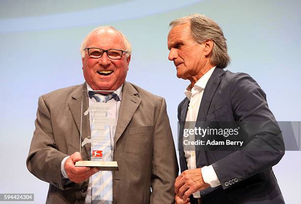 Former soccer player Uwe Seeler and former soccer player Wolfgang Overath attend a Bundesliga gala award evening on August 23, 2016 in Berlin,...