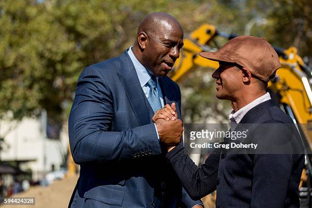 Part LAFC owner Earvin "Magic" Johnson chats with former professional soccer player Calen Carr at the Los Angeles Football Club Stadium...