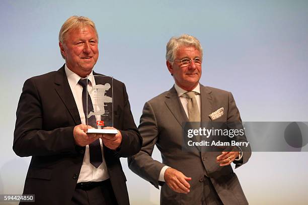 Former soccer coach Horst Hrubesch and sport commentator Marcel Reif attend a Bundesliga gala award evening on August 23, 2016 in Berlin, Germany....