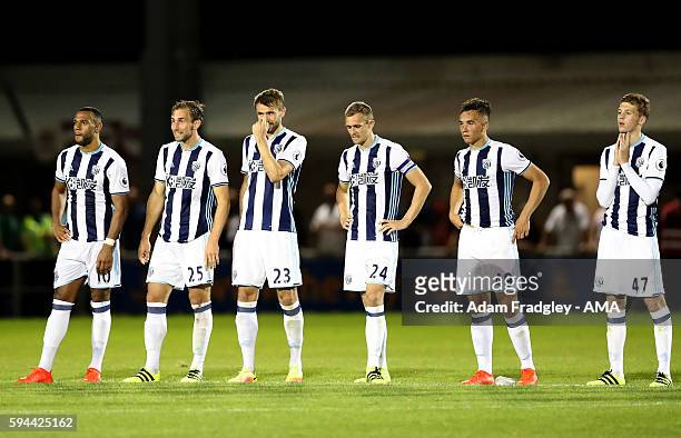 West Bromwich Albion players watch as they lose 4-3 on penalties during the EFL Cup fixture between Northampton Town and West Bromwich Albion at...
