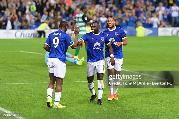 Arouna Kone celebrates his second goal with Yannick Bolasie and Ashley Williams during the EFL Cup match between Everton and Yeovil Town at Goodison...