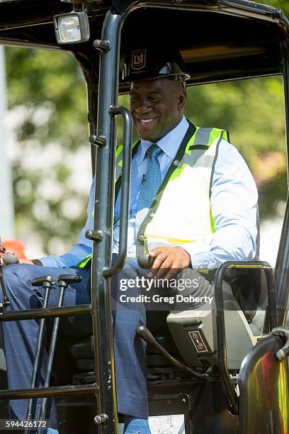 Part LAFC owner Earvin "Magic" Johnson operates a digger at the Los Angeles Football Club Stadium Groundbreaking Ceremony on August 23, 2016 in Los...