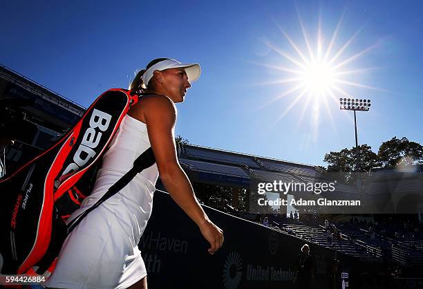 Elena Vesnina of Russia walks on the court before her match against Annett Kontaveit of Estonia on day 3 of the Connecticut Open at the Connecticut...