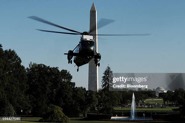 Marine One, carrying U.S. President Barack Obama on board, prepares to land on the South Lawn of the White House in Washington, D.C. On Tuesday, Aug....