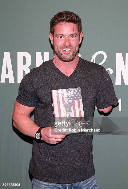 Noah Galloway signs copies of "Living With No Excuses: The Remarkable Rebirth Of An American Soldier" at Barnes & Noble Tribeca on August 23, 2016 in...