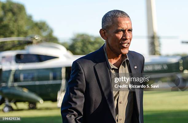 President Barack Obama steps off Marine One after returning to the White House from Baton Rouge Louisiana, on August 23, 2016 in Washington, DC.