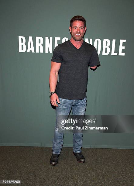 Noah Galloway signs copies of 'Living With No Excuses: The Remarkable Rebirth Of An American Soldier' at Barnes & Noble Tribeca on August 23, 2016 in...