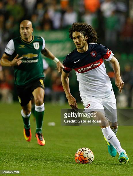 Fabricio Coloccini of San Lorenzo drives the ball during a first leg match between Banfield and San Lorenzo as part of second round of Copa...