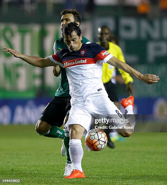 Alberto Facundo Costa of San Lorenzo fights for the ball with Nicolas Santiago Bertolo of Banfield during a first leg match between Banfield and San...