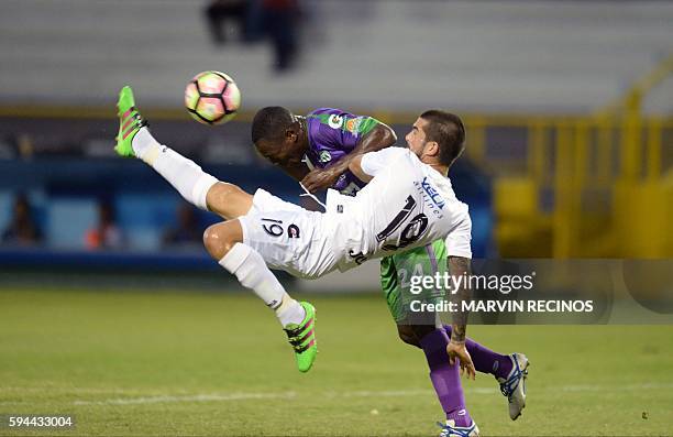 Walter Vazquez of Salvadorean team Alianza fights for the ball with Roberto Pena of Guatemalan Antigua Guatemala during a CONCACAF Champions League...