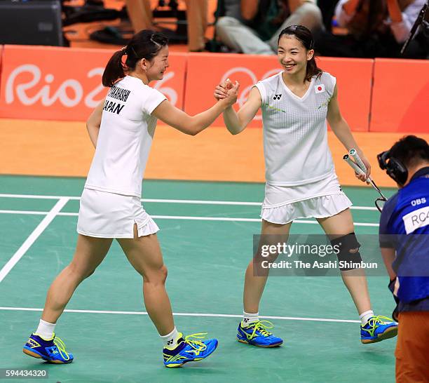 Misaki Matsutomo and Ayaka Takahashi of Japan celebrate after winning the gold medal in the Women's Doubles on Day 13 of the Rio 2016 Olympic Games...