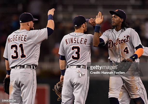 Casey McGehee, Ian Kinsler and Cameron Maybin of the Detroit Tigers celebrate winning the game against the Minnesota Twins on August 23, 2016 at...