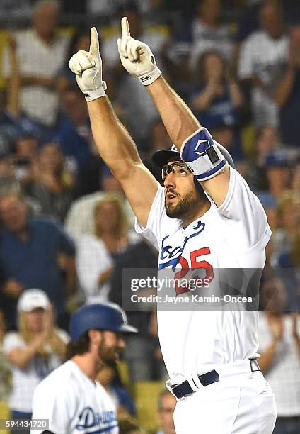 Rob Segedin of the Los Angeles Dodgers crosses the plate after a solo home run in the second inning of the game against the San Francisco Giants at...