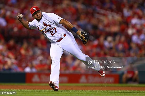 Jhonny Peralta of the St. Louis Cardinals fails to throw out a runner against the New York Mets in the ninth inning at Busch Stadium on August 24,...