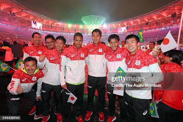 Japanese athletes pose for photographs during the Closing Ceremony on Day 16 of the Rio 2016 Olympic Games at Maracana Stadium on August 21, 2016 in...