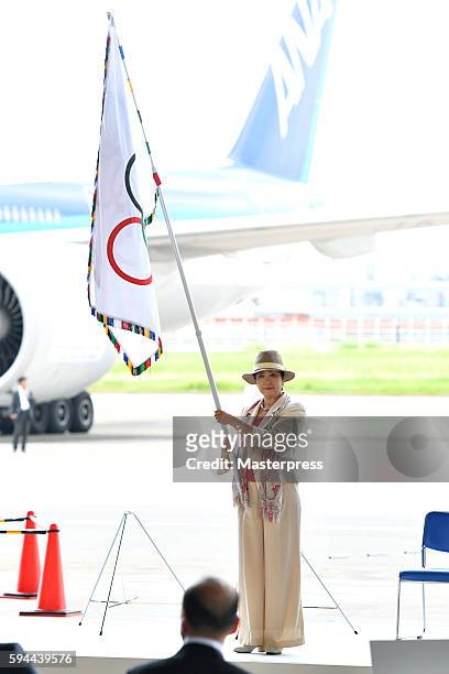 Tokyo Governor Yuriko Koike with the Olympic flag during the "The Arrival of Olympic Flag Ceremony" at Haneda Airport on August 24, 2016 in Tokyo,...