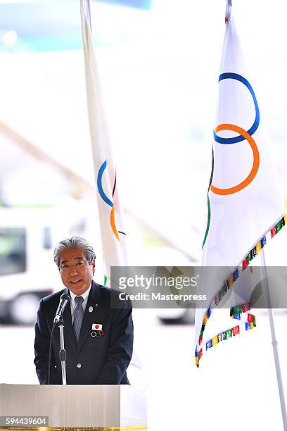 Japanese Olympic CommitteePresident Tsunekazu Takeda speaks during the "The Arrival of Olympic Flag Ceremony" at Haneda Airport on August 24, 2016 in...