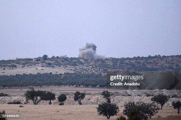 The photo taken from Karkamis district of the Turkey's Gaziantep province shows smoke rising as the Turkish fighter jets bomb Daesh targets in...