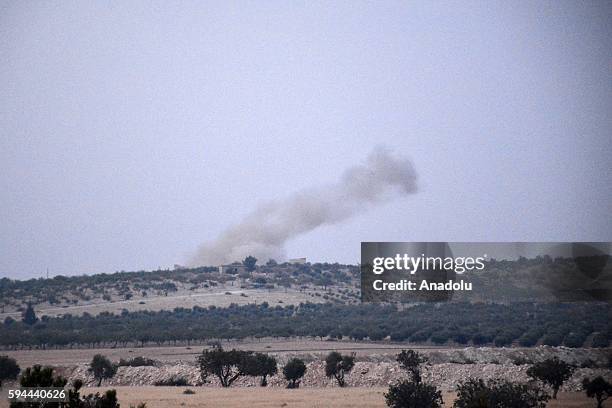 The photo taken from Karkamis district of the Turkey's Gaziantep province shows smoke rising as the Turkish fighter jets bomb Daesh targets in...