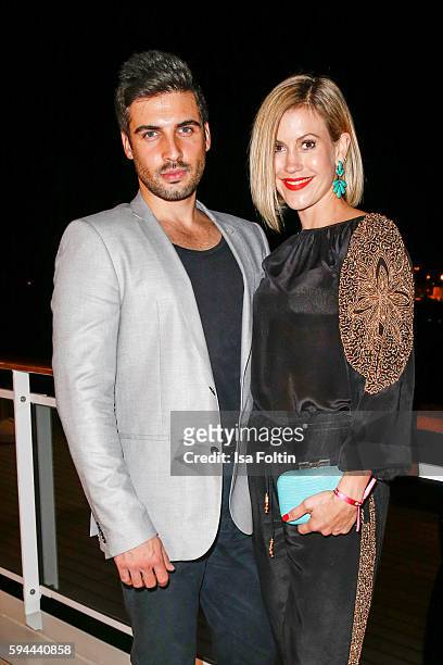 German actress Wolke Hegenbarth and her boyfriend Oliver Vaid attend the Fashion2Night event at EUROPA 2 on August 23, 2016 in Hamburg, Germany.