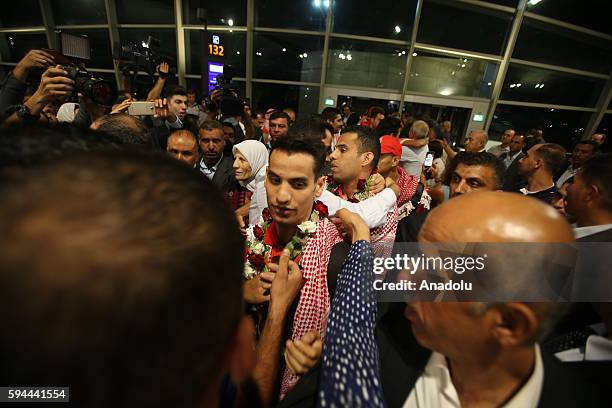 Jordanian athlete Ahmad Abughaush , who won gold medal in Men's 68 kg Taekwondo in Rio 2016 Olympic Games, is welcomed by his family and his...