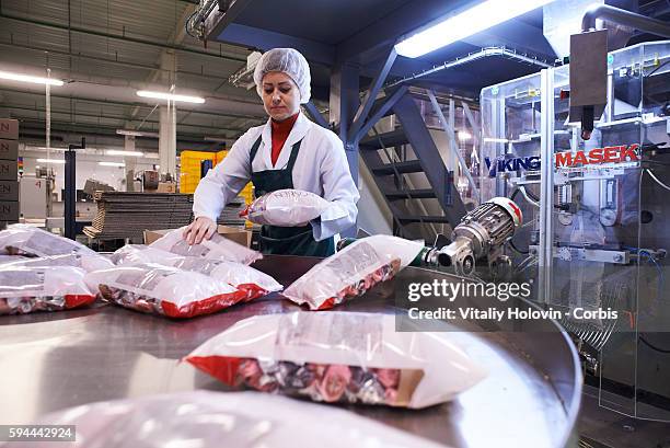 Workers pack chocolate products in a factory on June 19, 2016 in Vinnytsia, Ukraine. Roshen Confectionery Corporation is a Ukrainian confectionery...