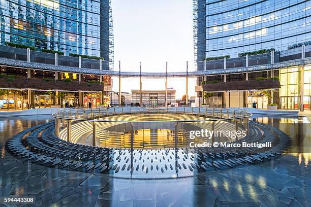 gae aulenti square in porta nuova business district. - milan financial district stock pictures, royalty-free photos & images