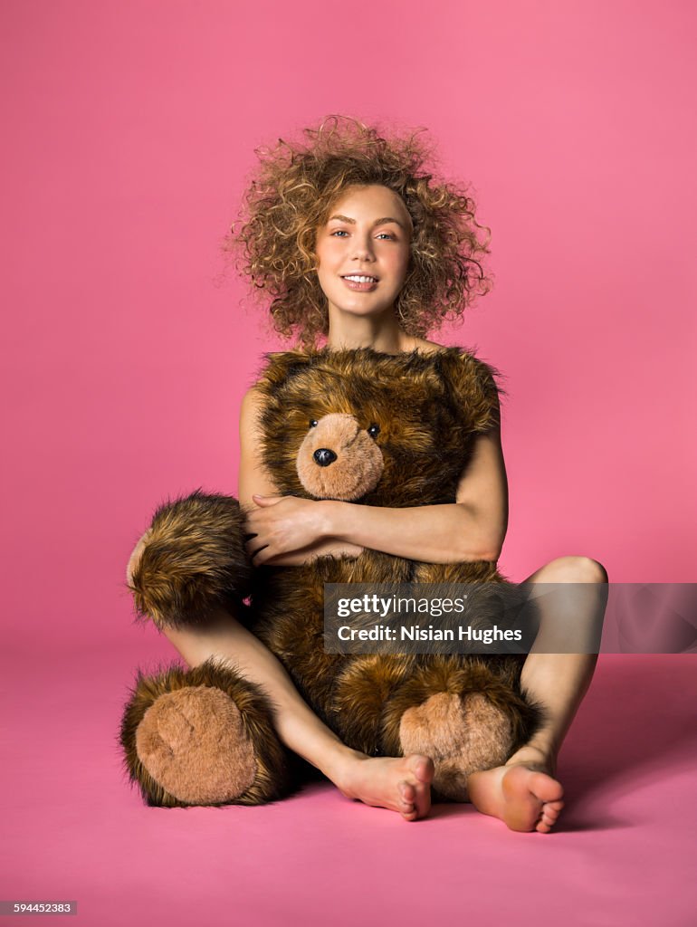 Woman hugging large stuffed animal bear