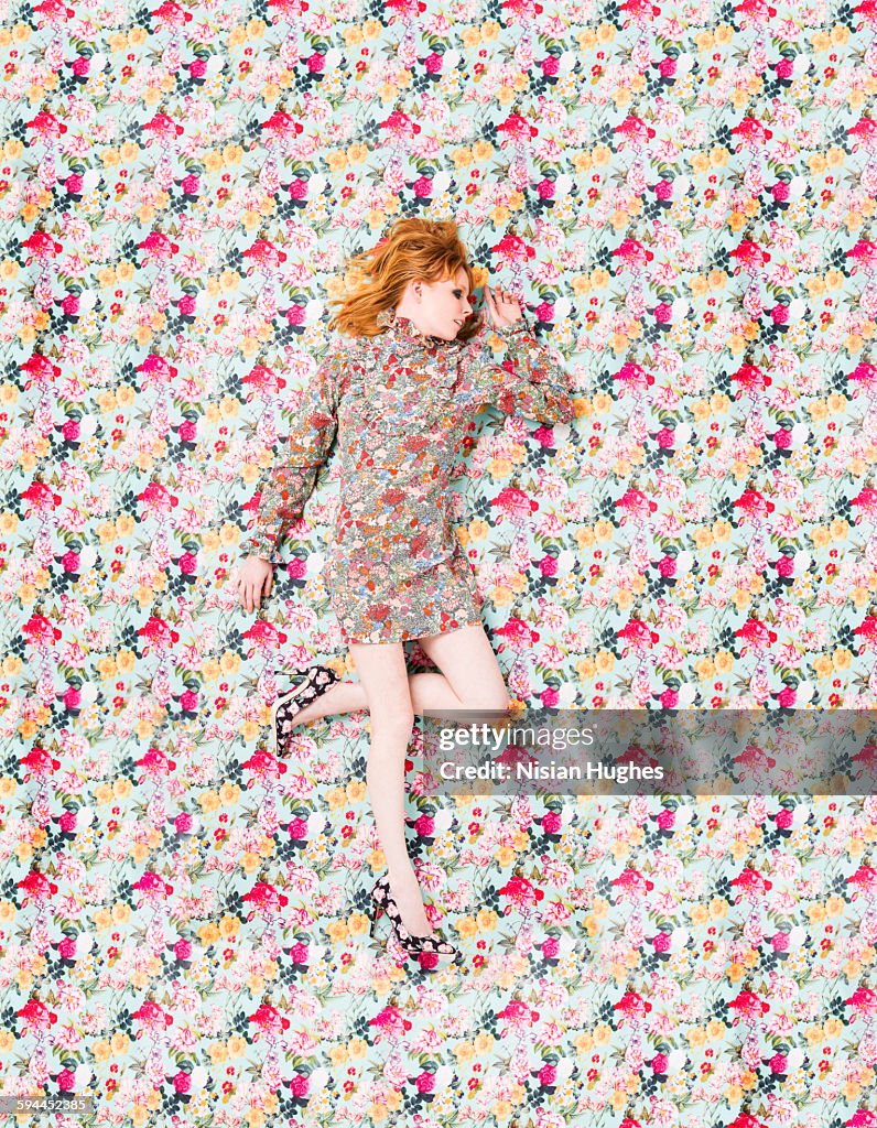 Woman with floral print on floral background