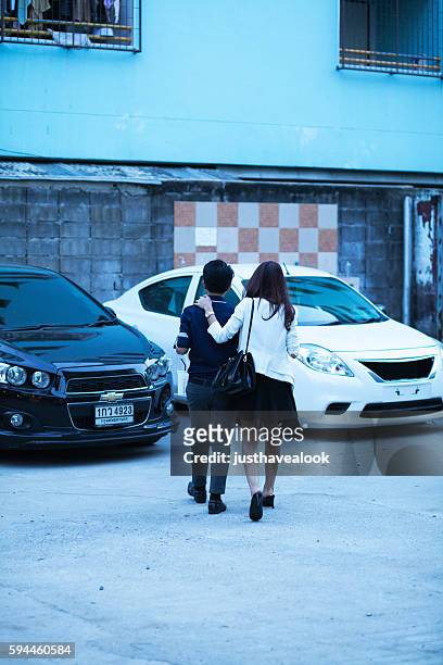 thai girl and tomboy going to car - tomboy stock pictures, royalty-free photos & images