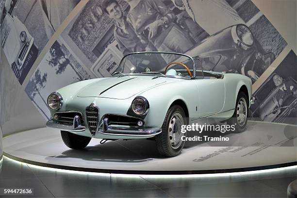 alfa romeo giulietta spider in the car showroom - alfa romeo spider stock pictures, royalty-free photos & images