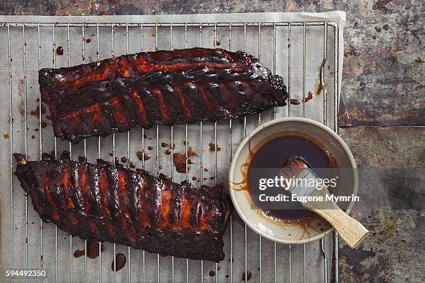 pomegranate and red wine glazed pork ribs - metal grate stock pictures, royalty-free photos & images