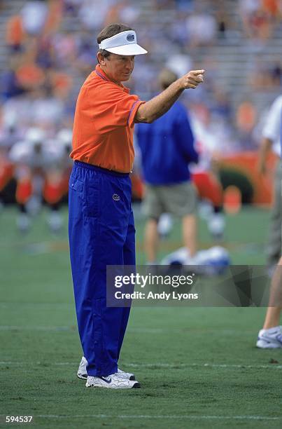 Head Coach Steve Spurrier of the Florida Gators points on the field in practice before the game against the Ball State Cardinals at Florida Field in...