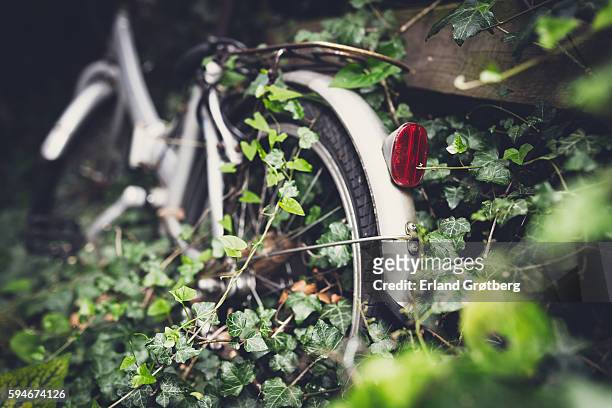 abandoned bike - overgrown stock pictures, royalty-free photos & images