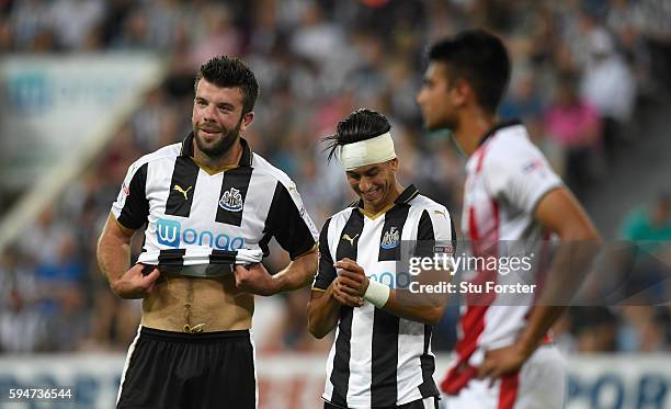 Newcastle goalscorer Ayoze Perez shares a joke with Grant Hanley during the EFL Cup Round Two match between Newcastle United and Cheltenham Town at...